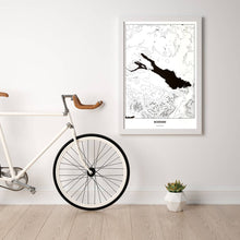 Lade das Bild in den Galerie-Viewer, Bodensee Light Poster - Minimal - Vorschau in einem hellen Zimmer mit Fahrrad an Wand angelehnt
