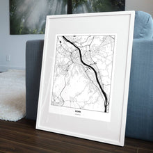 Lade das Bild in den Galerie-Viewer, Bonn Light Poster - Minimal - Vorschau in einem Wohnzimmer am Boden aufgestellt und auf der Couch angelehnt