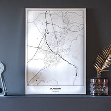 Lade das Bild in den Galerie-Viewer, Dornbirn Light Poster - Minimal - Vorschau neben Dekoartikeln vor dunkelgrauer Wand