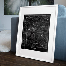 Lade das Bild in den Galerie-Viewer, Dortmund Dark Poster - Minimal - Vorschau in einem Wohnzimmer am Boden aufgestellt und auf der Couch angelehnt