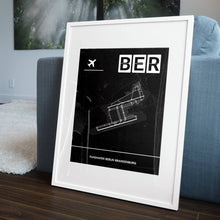 Lade das Bild in den Galerie-Viewer, Flughafen Berlin Brandenburg (BER / EDDB) Dark Poster - Minimal - Vorschau in einem Wohnzimmer am Boden aufgestellt und auf der Couch angelehnt