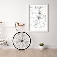 Lade das Bild in den Galerie-Viewer, Heilbronn Light Poster - Minimal - Vorschau in einem hellen Zimmer mit Fahrrad an Wand angelehnt