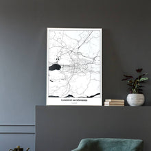 Lade das Bild in den Galerie-Viewer, Klagenfurt am Wörthersee Light Poster - Minimal - Vorschau in einem eleganten Zimmer mit Sessel und grauer Wand