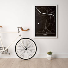 Lade das Bild in den Galerie-Viewer, Lauterach Dark Poster - Minimal - Vorschau in einem hellen Zimmer mit Fahrrad an Wand angelehnt