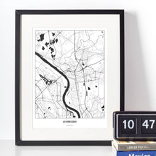 Lade das Bild in den Galerie-Viewer, Leverkusen Light Poster - Minimal - Vorschau vor weißer Wand zusammen mit Dekoartikeln