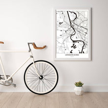 Lade das Bild in den Galerie-Viewer, Ludwigshafen am Rhein Light Poster - Minimal - Vorschau in einem hellen Zimmer mit Fahrrad an Wand angelehnt