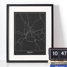 Lade das Bild in den Galerie-Viewer, Mistelbach Dark Poster - Minimal - Vorschau vor weißer Wand zusammen mit Dekoartikeln