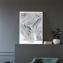Lade das Bild in den Galerie-Viewer, Mount Everest Light Poster - Minimal - Vorschau in einem eleganten Zimmer mit Sessel und grauer Wand
