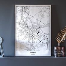 Lade das Bild in den Galerie-Viewer, Nürnberg Light Poster - Minimal - Vorschau neben Dekoartikeln vor dunkelgrauer Wand