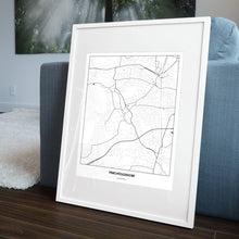 Lade das Bild in den Galerie-Viewer, Perchtoldsdorf Light Poster - Minimal - Vorschau in einem Wohnzimmer am Boden aufgestellt und auf der Couch angelehnt