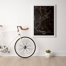 Lade das Bild in den Galerie-Viewer, Rankweil Dark Poster - Minimal - Vorschau in einem hellen Zimmer mit Fahrrad an Wand angelehnt