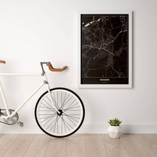 Lade das Bild in den Galerie-Viewer, Reutlingen Dark Poster - Minimal - Vorschau in einem hellen Zimmer mit Fahrrad an Wand angelehnt