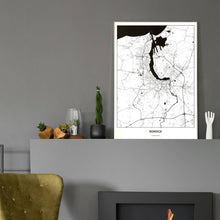Lade das Bild in den Galerie-Viewer, Rostock Light Poster - Minimal - Vorschau in einem eleganten Zimmer mit Kamin und grauer Wandfarbe
