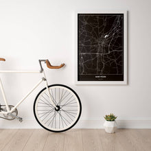Lade das Bild in den Galerie-Viewer, Sankt Pölten Dark Poster - Minimal - Vorschau in einem hellen Zimmer mit Fahrrad an Wand angelehnt