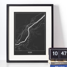 Lade das Bild in den Galerie-Viewer, Schwaz Dark Poster - Minimal - Vorschau vor weißer Wand zusammen mit Dekoartikeln
