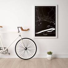 Lade das Bild in den Galerie-Viewer, Stockerau Dark Poster - Minimal - Vorschau in einem hellen Zimmer mit Fahrrad an Wand angelehnt