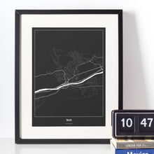 Lade das Bild in den Galerie-Viewer, Telfs Dark Poster - Minimal - Vorschau vor weißer Wand zusammen mit Dekoartikeln