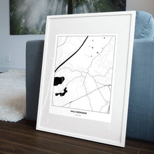 Lade das Bild in den Galerie-Viewer, Wals-Siezenheim Light Poster - Minimal - Vorschau in einem Wohnzimmer am Boden aufgestellt und auf der Couch angelehnt