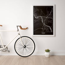 Lade das Bild in den Galerie-Viewer, Würzburg Dark Poster - Minimal - Vorschau in einem hellen Zimmer mit Fahrrad an Wand angelehnt