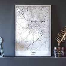 Lade das Bild in den Galerie-Viewer, Aachen Light Poster - Minimal - Vorschau neben Dekoartikeln vor dunkelgrauer Wand
