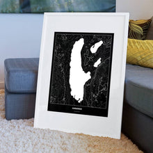 Lade das Bild in den Galerie-Viewer, Ammersee Dark Poster - Minimal - Vorschau am Boden auf Couch angelehnt in einem Wohnzimmer
