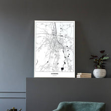 Lade das Bild in den Galerie-Viewer, Augsburg Light Poster - Minimal - Vorschau in einem eleganten Zimmer mit Sessel und grauer Wand
