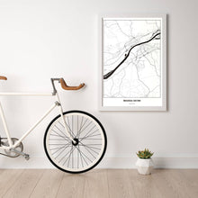 Lade das Bild in den Galerie-Viewer, Braunau am Inn Light Poster - Minimal - Vorschau in einem hellen Zimmer mit Fahrrad an Wand angelehnt
