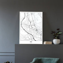 Lade das Bild in den Galerie-Viewer, Fürth Light Poster - Minimal - Vorschau in einem eleganten Zimmer mit Sessel und grauer Wand
