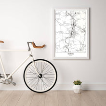 Lade das Bild in den Galerie-Viewer, Heilbronn Light Poster - Minimal - Vorschau in einem hellen Zimmer mit Fahrrad an Wand angelehnt
