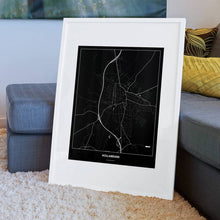 Lade das Bild in den Galerie-Viewer, Hollabrunn Dark Poster - Minimal - Vorschau am Boden auf Couch angelehnt in einem Wohnzimmer
