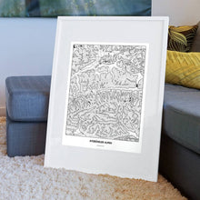 Lade das Bild in den Galerie-Viewer, Kitzbüheler Alpen Light Poster - Minimal - Vorschau am Boden auf Couch angelehnt in einem Wohnzimmer
