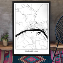 Lade das Bild in den Galerie-Viewer, Krems an der Donau Light Poster - Minimal - Vorschau aufgestellt auf Boden an grauer Wand angelehnt
