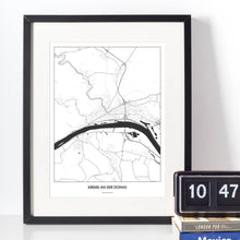 Lade das Bild in den Galerie-Viewer, Krems an der Donau Light Poster - Minimal - Vorschau vor weißer Wand zusammen mit Dekoartikeln
