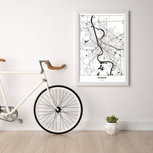 Lade das Bild in den Galerie-Viewer, Mannheim Light Poster - Minimal - Vorschau in einem hellen Zimmer mit Fahrrad an Wand angelehnt
