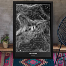 Lade das Bild in den Galerie-Viewer, Matterhorn Dark Poster - Minimal - Vorschau aufgestellt auf Boden an grauer Wand angelehnt
