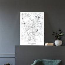 Lade das Bild in den Galerie-Viewer, Mönchen­gladbach Light Poster - Minimal - Vorschau in einem eleganten Zimmer mit Sessel und grauer Wand
