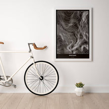 Lade das Bild in den Galerie-Viewer, Mont Blanc Dark Poster - Minimal - Vorschau in einem hellen Zimmer mit Fahrrad an Wand angelehnt
