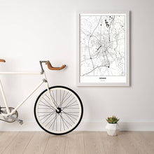Lade das Bild in den Galerie-Viewer, Münster Light Poster - Minimal - Vorschau in einem hellen Zimmer mit Fahrrad an Wand angelehnt
