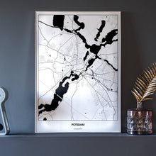 Lade das Bild in den Galerie-Viewer, Potsdam Light Poster - Minimal - Vorschau neben Dekoartikeln vor dunkelgrauer Wand
