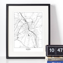 Lade das Bild in den Galerie-Viewer, Salzburg Light Poster - Minimal - Vorschau vor weißer Wand zusammen mit Dekoartikeln
